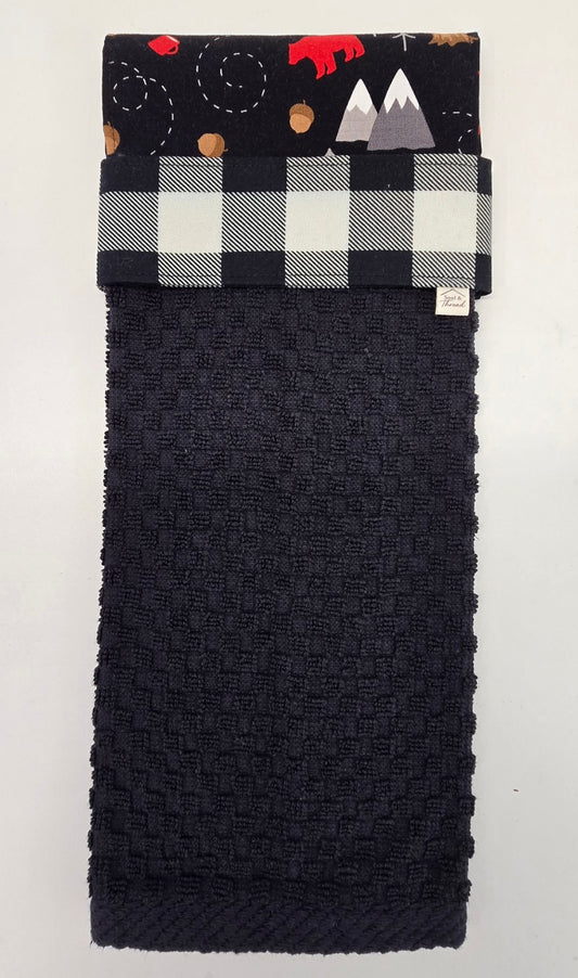 Black hanging towel with black and white buffalo plaid band and Cabin Trail topper