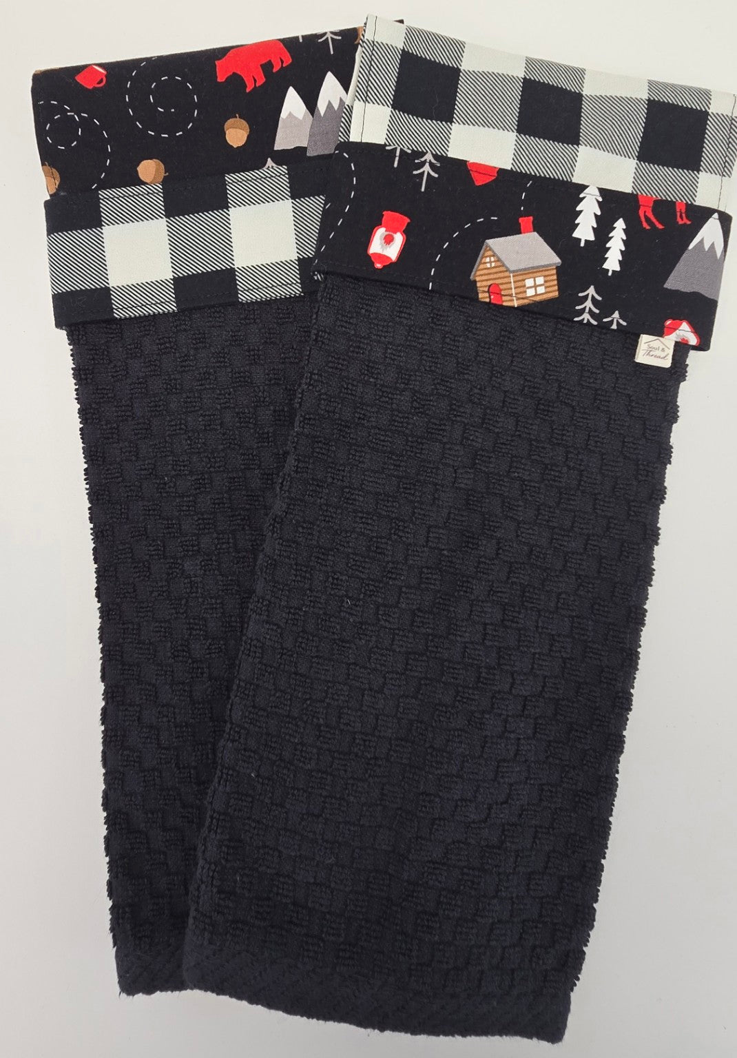 Two coordinating Cabin Trail hanging towels