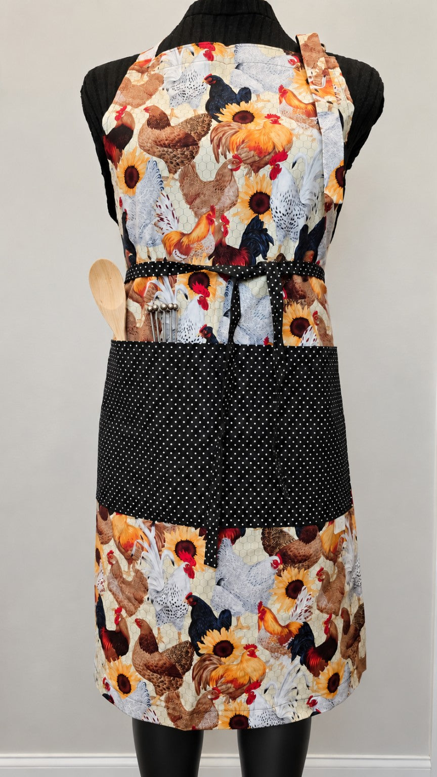 Hen House handmade full-length apron with chicken and sunflower print and black polka dot pocket