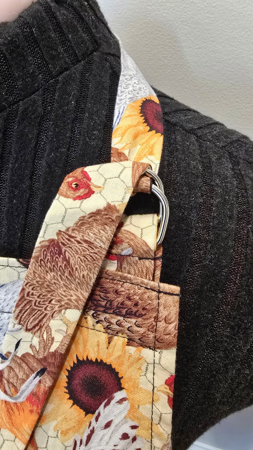 Close-up of adjustable metal ring neck strap on Hen House apron