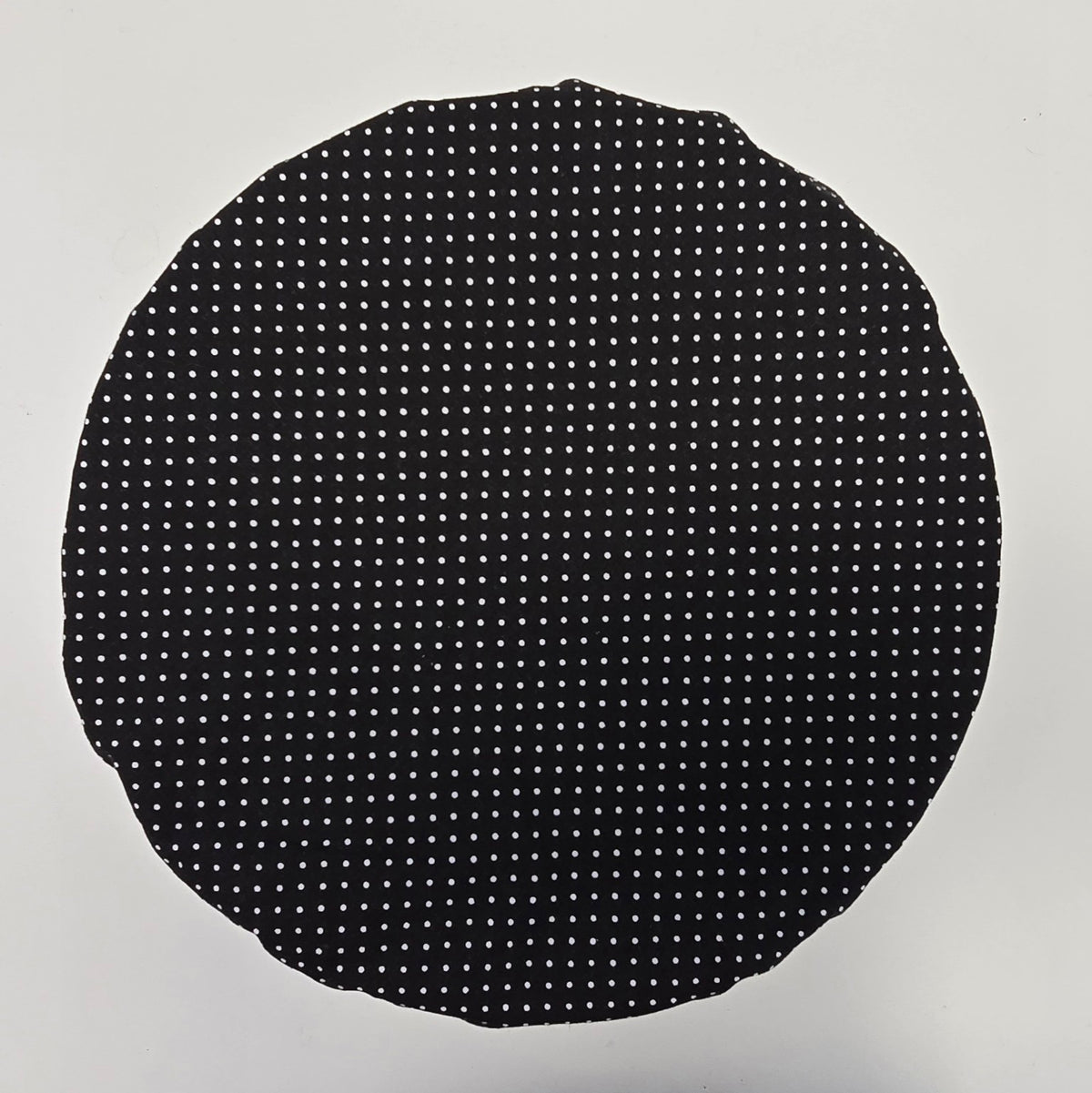 Black and white polka dot reverse side of Hen House reusable bowl cover