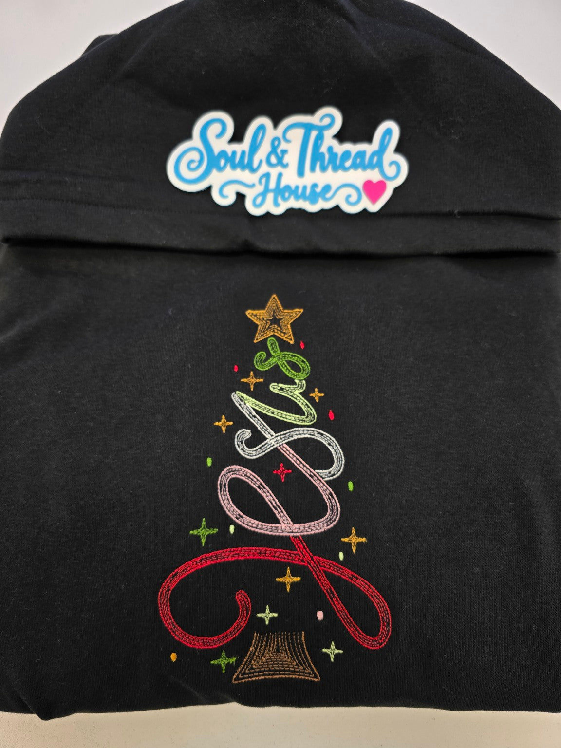 Detailed colourful Jesus Christmas tree embroidery with golden star